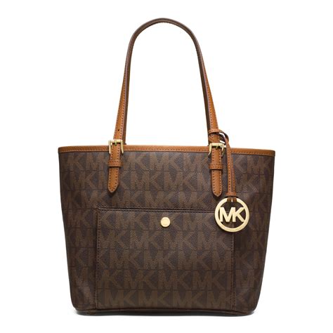 michael michael kors jet set travel medium logo tote|Michael Kors bag with airplanes.